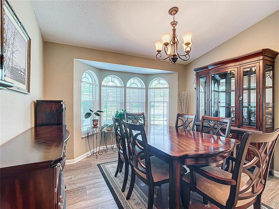 The dining room has a bay window and sits on newer laminate. Good space and a nice view of the front yard area.