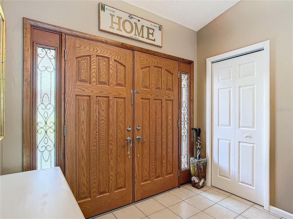 The foyer has ceramic tile and a closet for those jackets and umbrellas.