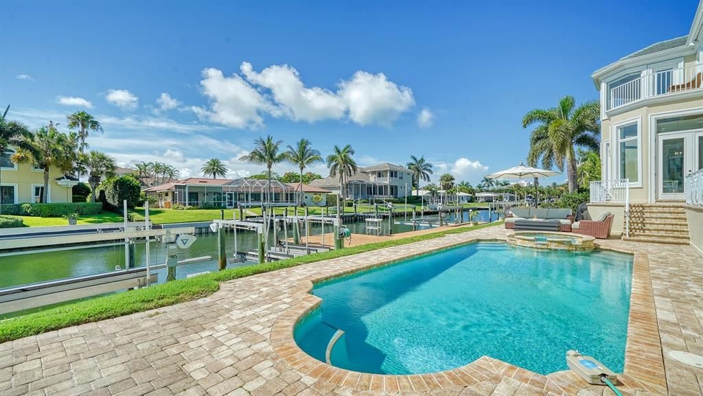 In ground heated pool overlooks canal and bay views