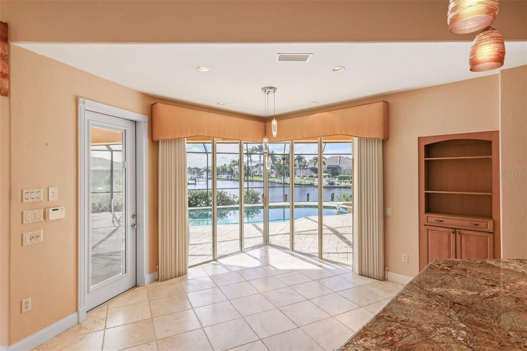 Breakfast nook with zero corner sliders to the pool area