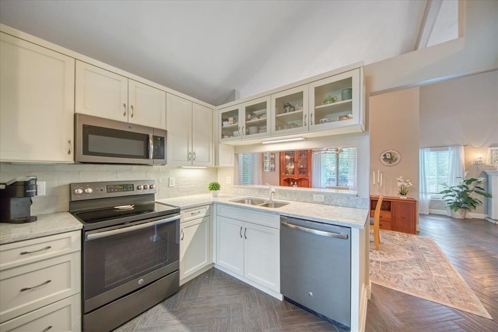 Open serving counter, tile splash wall & glass front cabinets~