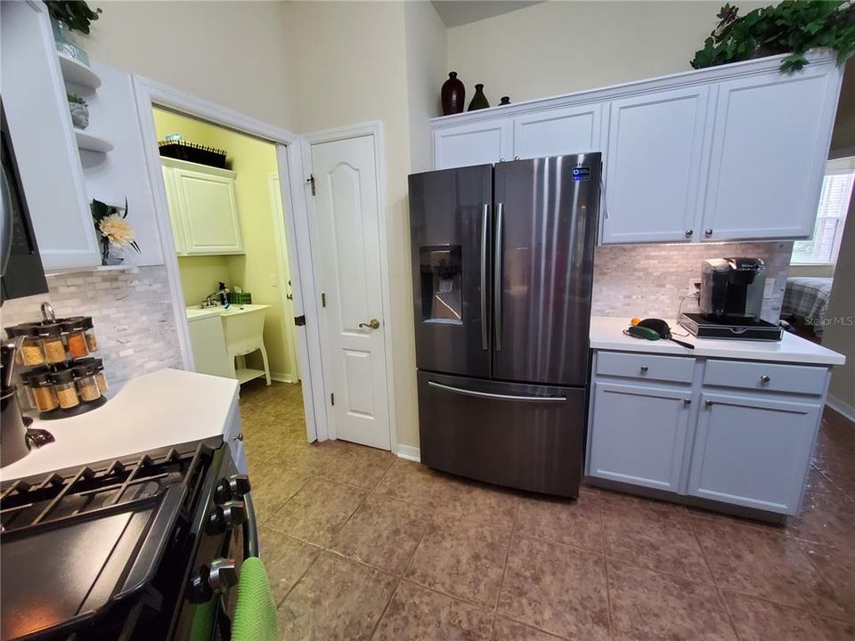 Kitchen looking into laundry