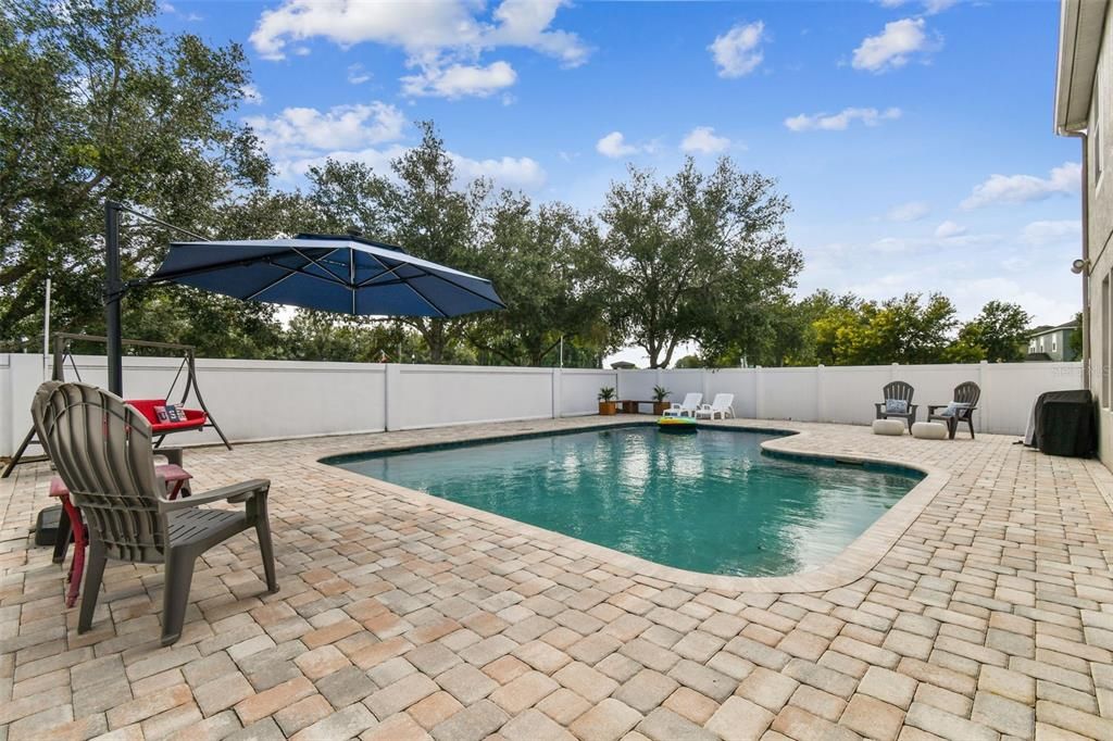 large private pool with vinyl fencing