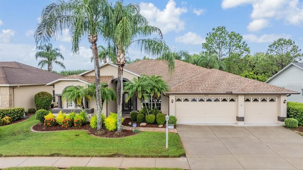 Covered entry with great curb appeal and 3-car garage