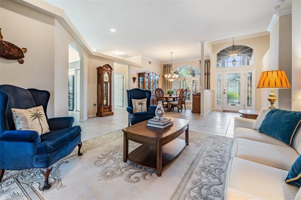 Living room views dining and entrance foyer