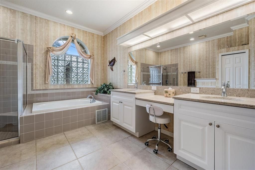 Large master bedroom with a whirlpool tub and separate, step in shower