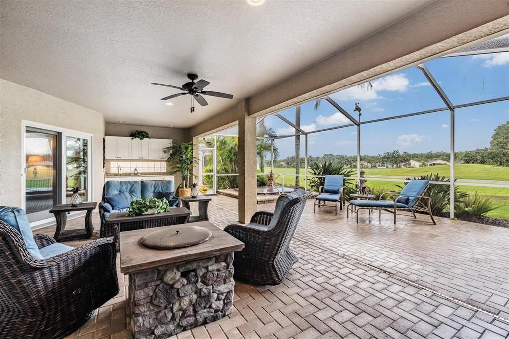 Oversized screened-in lanai with covered and uncovered areas