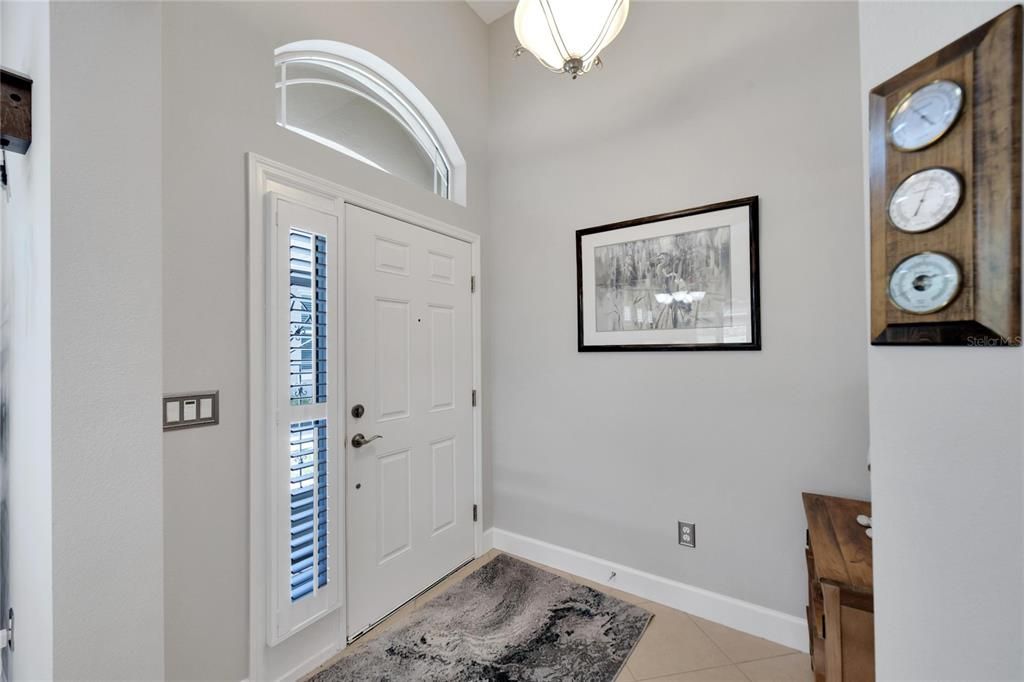 Foyer - curved transom window and plantation shutters