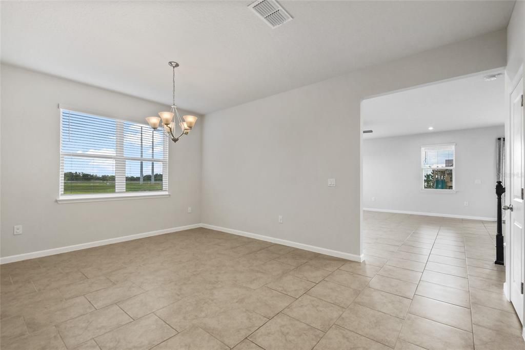 Here is the Dining Room that has views to the side yard and connects to the family room and kitchen.