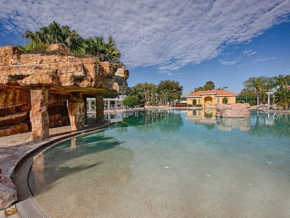 COMMUNITY RESORT STYLE POOL WITH BEACH ENTRY AND WATERFALL