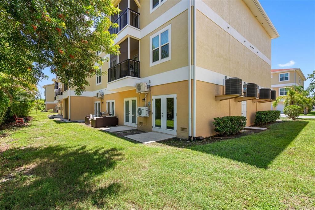 rear entry & patio behind unit