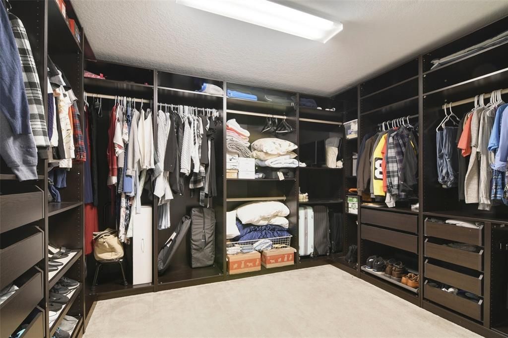 PRIMARY SUITE CUSTOM CLOSET.