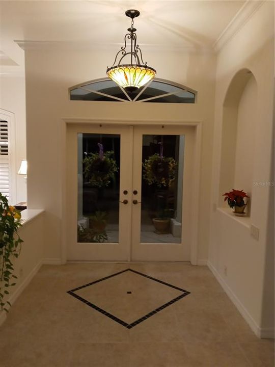 ENTRY FOYER WITH CUSTOM STAINED GLASS HANGING LAMP