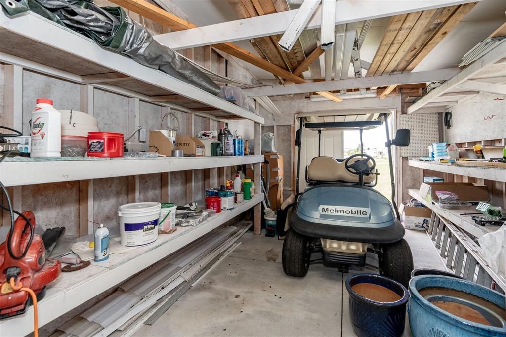 Second shed for a golf cart, work shop at 6339 Partridge Ave. Englewood FL 34224.  The Golf cart does not convey.