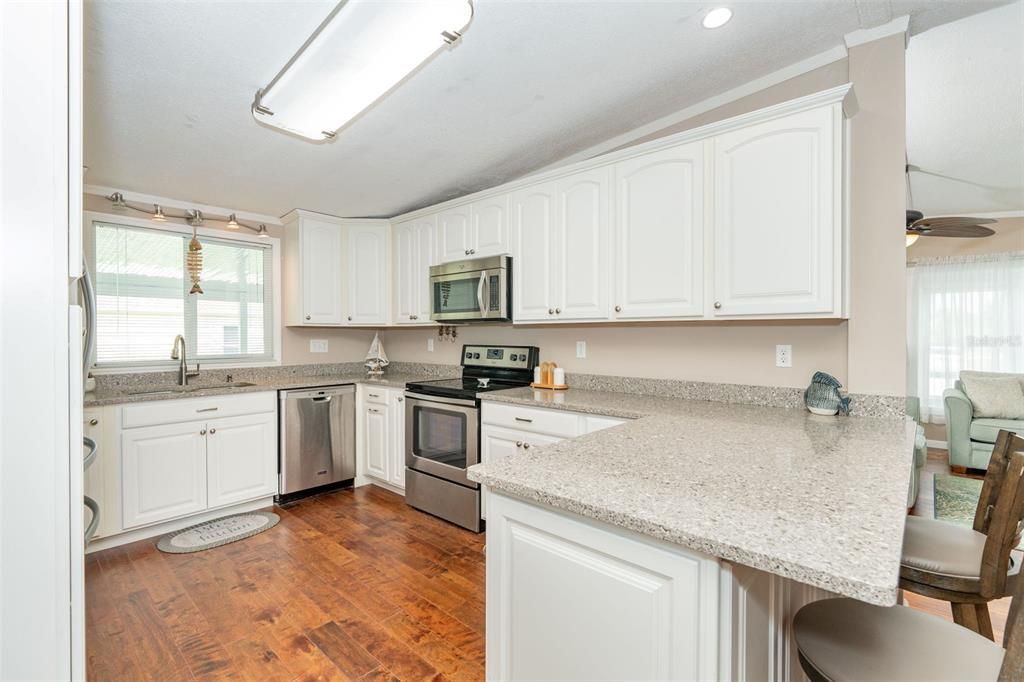 Beautiful light and bright kitchen, granite countertops, at 6339 Partridge Ave. Englewood FL 34224