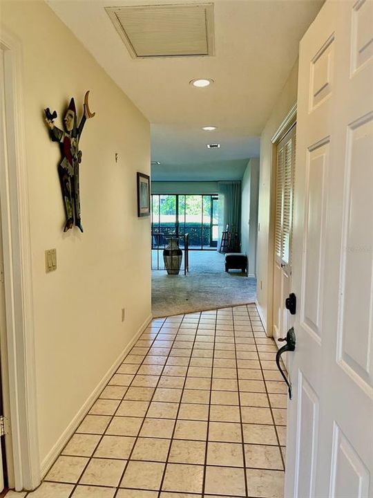 Wide foyer with plenty of room for a table or chest.