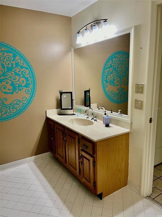 Bathroom #2 with tub/shower. Newer glass doors for the tub/shower. Tile floor, new fixtures.