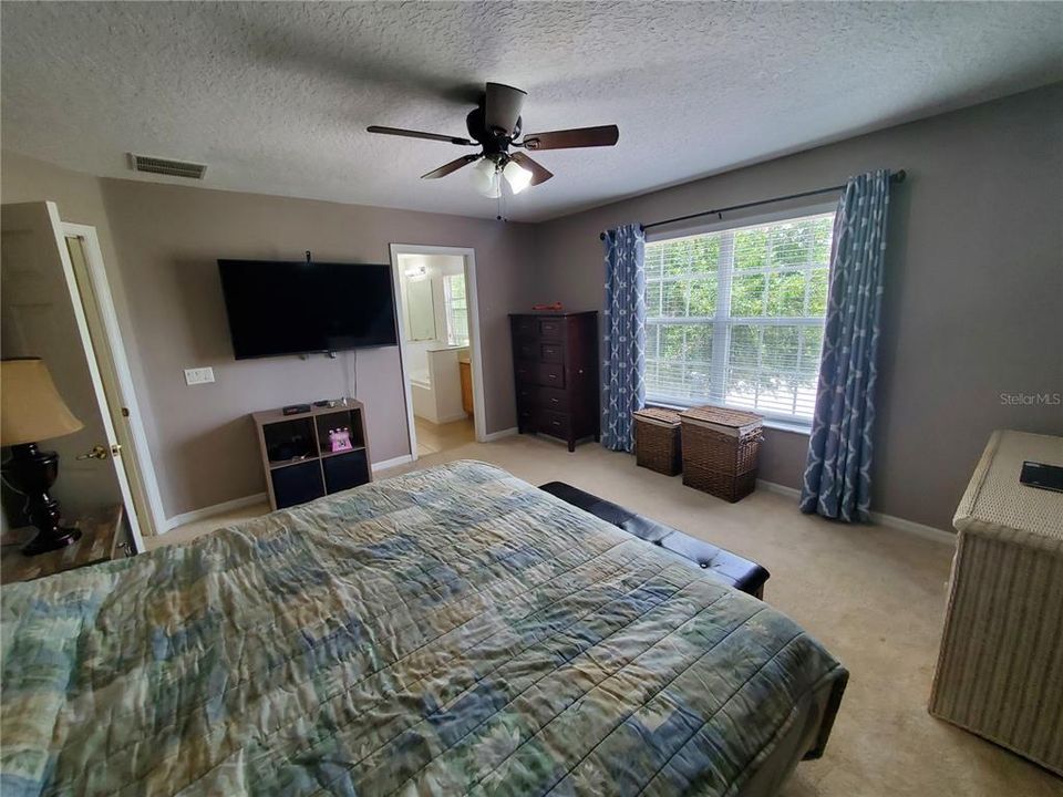 Master bathroom has two vanities, a garden tub and an update shower stall.