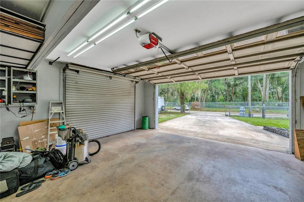 The oversized garage is 31' x 22' and has 2 8' overhead doors for access:  one from the driveway and another leading to the 2 car carport on the east side of the garage.  Perfect for a small business opportunity or the DIY hobbyist to utilize.