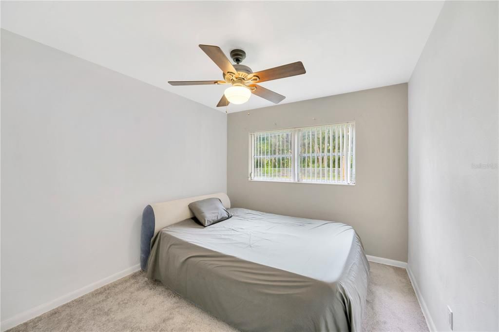 Bedroom #3 is 11' x 10', newly carpeted, with ceiling fan and closet and overlooks the front yard.