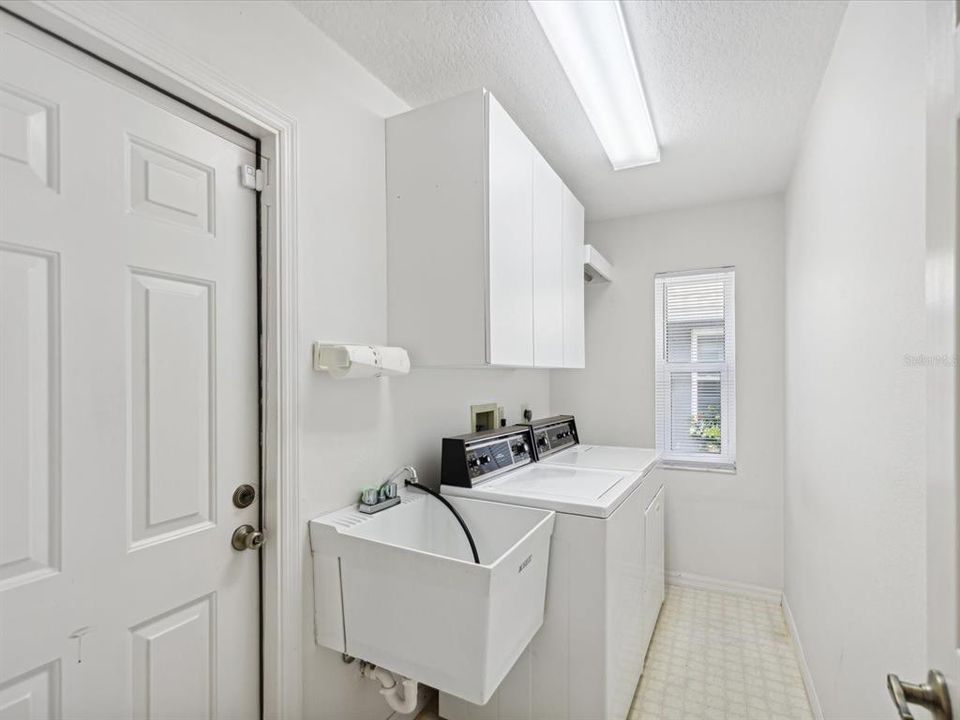 Indoor Laundry room with Utility Sink near Garage