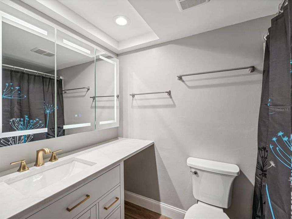 Bathroom with LED lighted mirror with dimming light and Anti-fog.