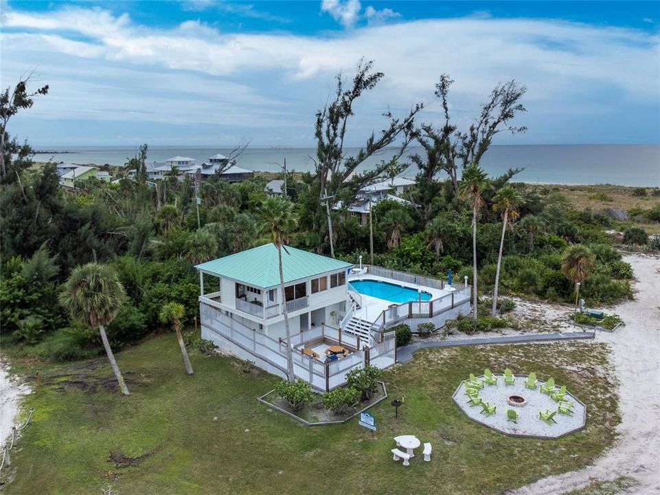 Placida Beach Club - Aerial view of clubhouse, pool, picnic area and fire pit