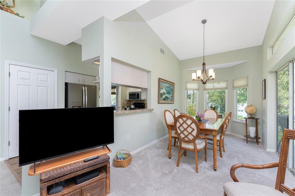 The dining area features pass-thru to kitchen for easy serving.