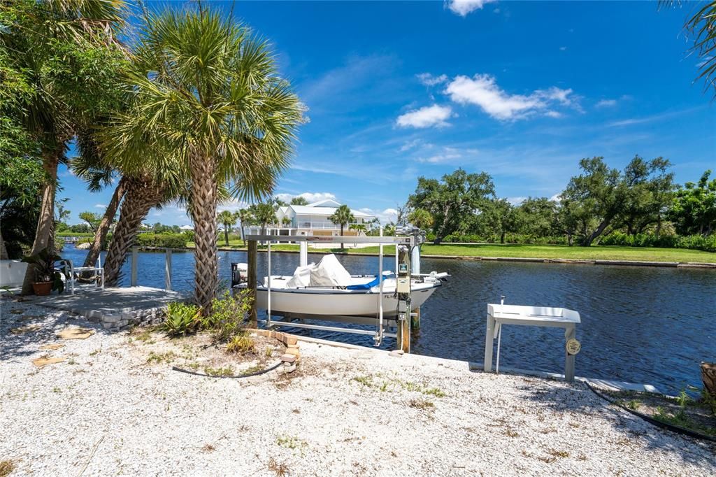 Concrete sea wall has a lift and floating dock.