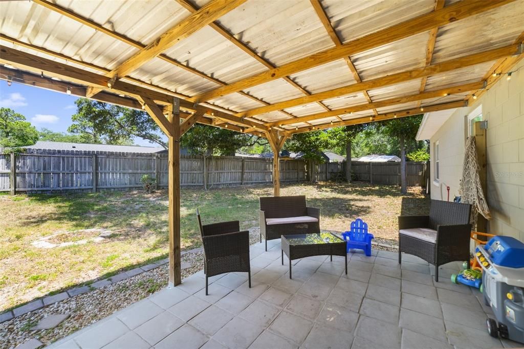 A covered patio is the perfect spot to relax in the shade overlooking a sprawling fenced backyard, .22 ACRES of a perfect blank canvas to create the backyard of your dreams.