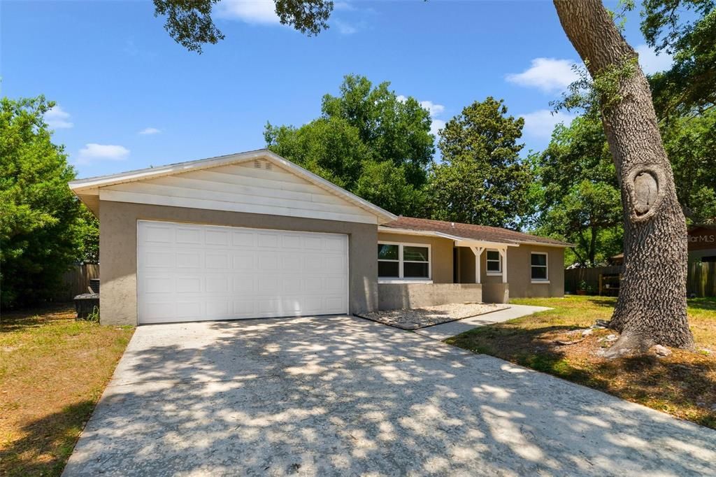 Perfectly situated between I-4, 417, and 17-92 in a quiet corner of Sanford, this 3BD/2BA home delivers a spacious lot with a fenced yard, UPDATED KITCHEN & WINDOWS, NEW A/C (2021), FRESH INTERIOR PAINT (2023, split bedrooms and TILE & WOOD LAMINATE FLOORS throughout!