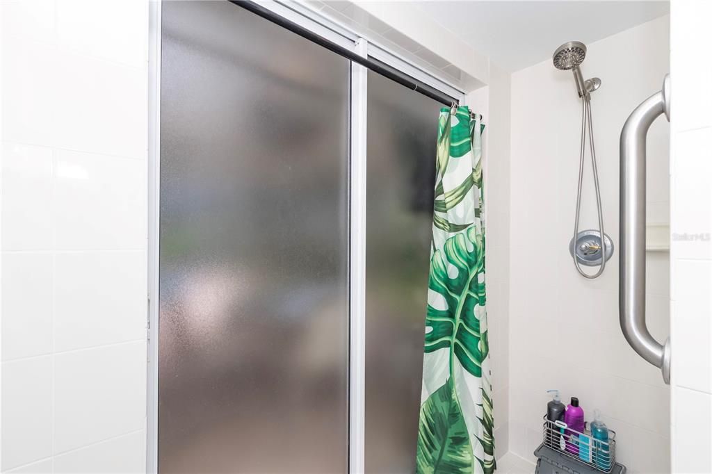 Master shower with doors to lanai