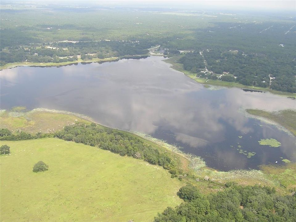 taken from the west side of the lake looking back at Rainbow Lakes, lots 499 and 500 are on the bottom corner of the picture.  This picture was taken by me about 25 years ago.  I have been selling lots in R.LE. for a long time.