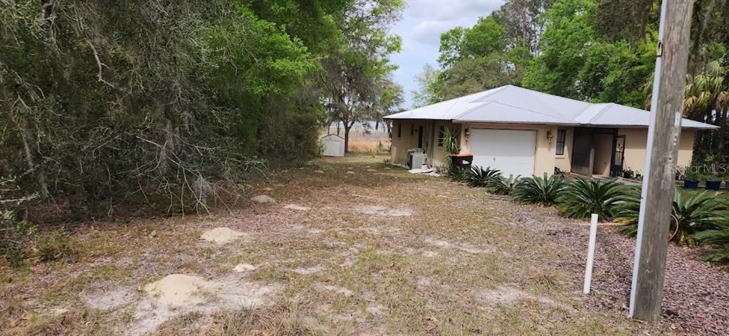 THE HOUSE TO THE RIGHT ON LOTS 497 & 498, LIGHT POLE ON CORNER, SHED ON MY LOT 499