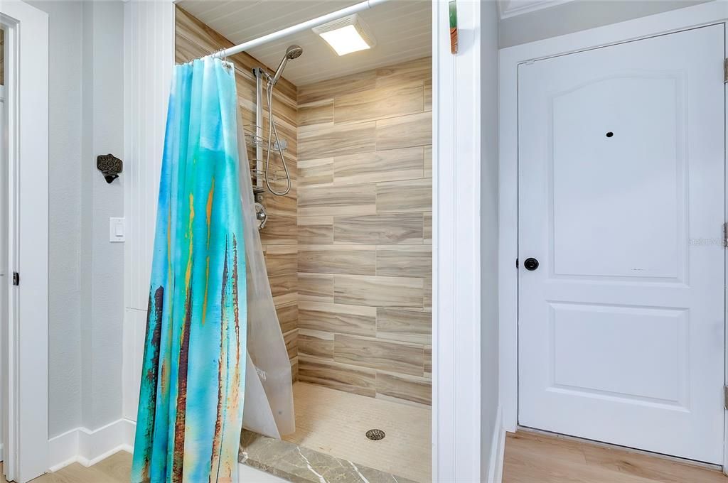 Second shower located by close to the outside and also to the garage for convenience from yard work.