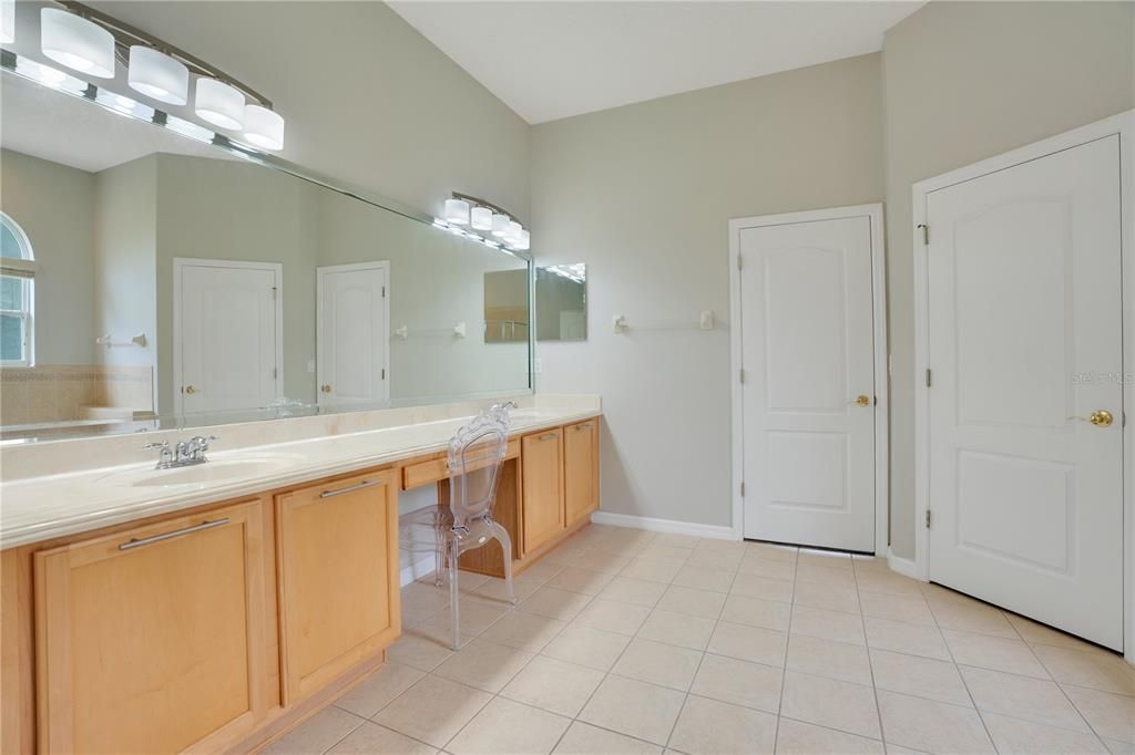 Double Vanity; Center Door Provides Access to Den/Flex Room; Right Door is Water Closet