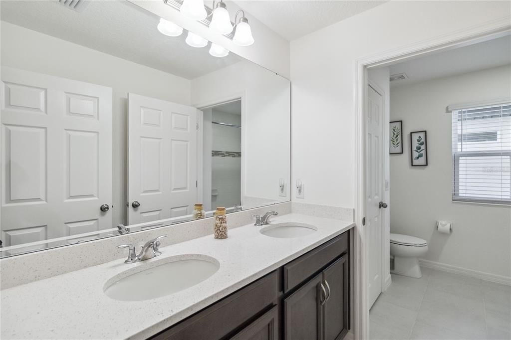 Dual sinks and private shower room