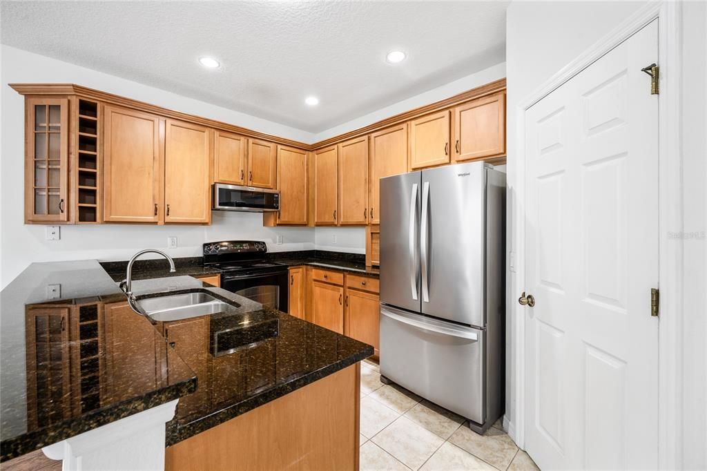 Nice open kitchen with granite counters. Refrigerator is 6 years young. Big closet pantry.