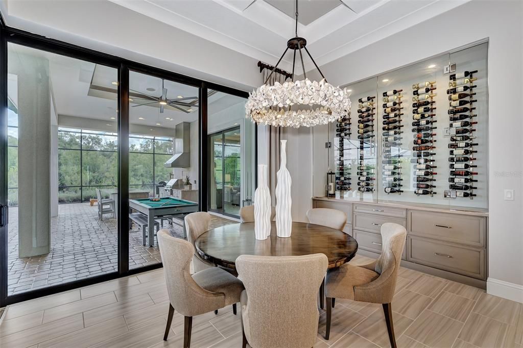 dining room with glass enclosed wine wall