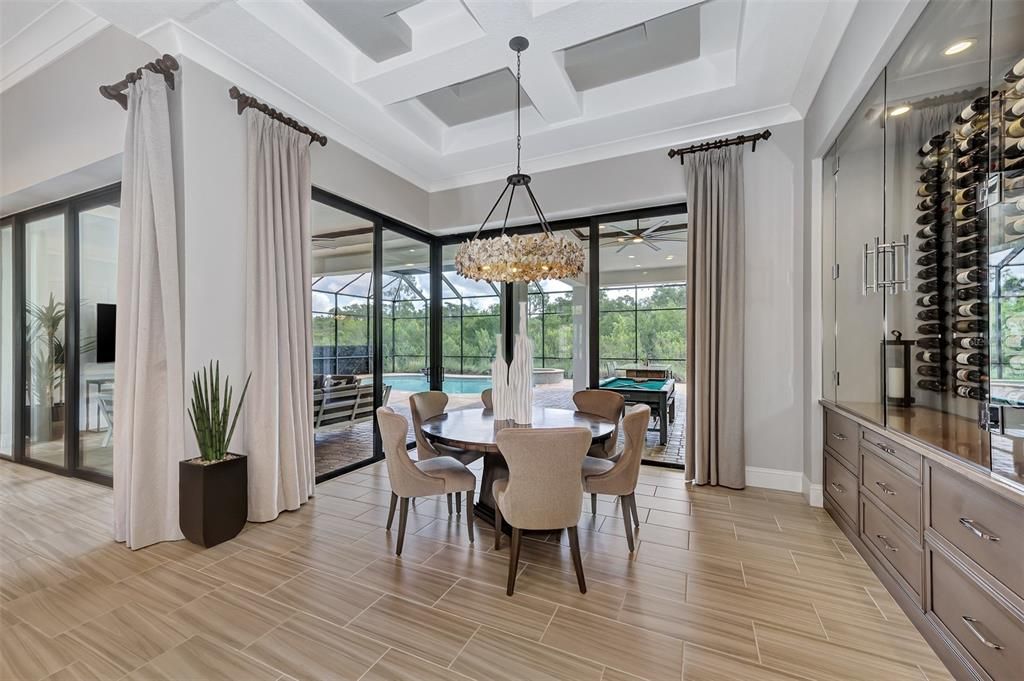 dining room with gorgeous 90 degree sliding doors opening completely to outdoor space