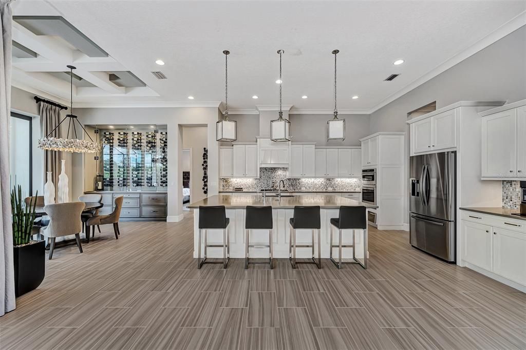 kitchen with view of the featured glass enclosed wine wall