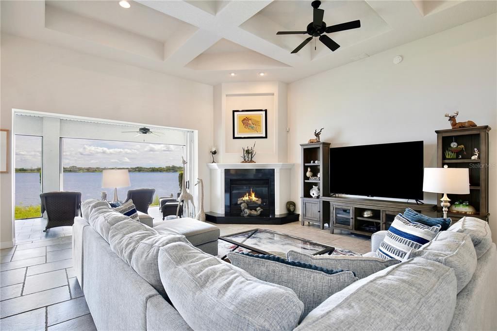 (24'X18') Family Room with spectacular lake views, a gas fireplace, and pocket sliding glass doors.