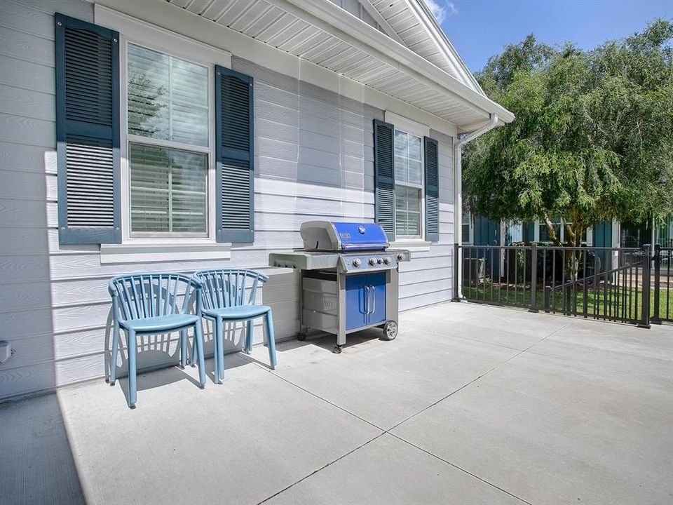 OPEN ELEVATED PATIO WITH RAILING.