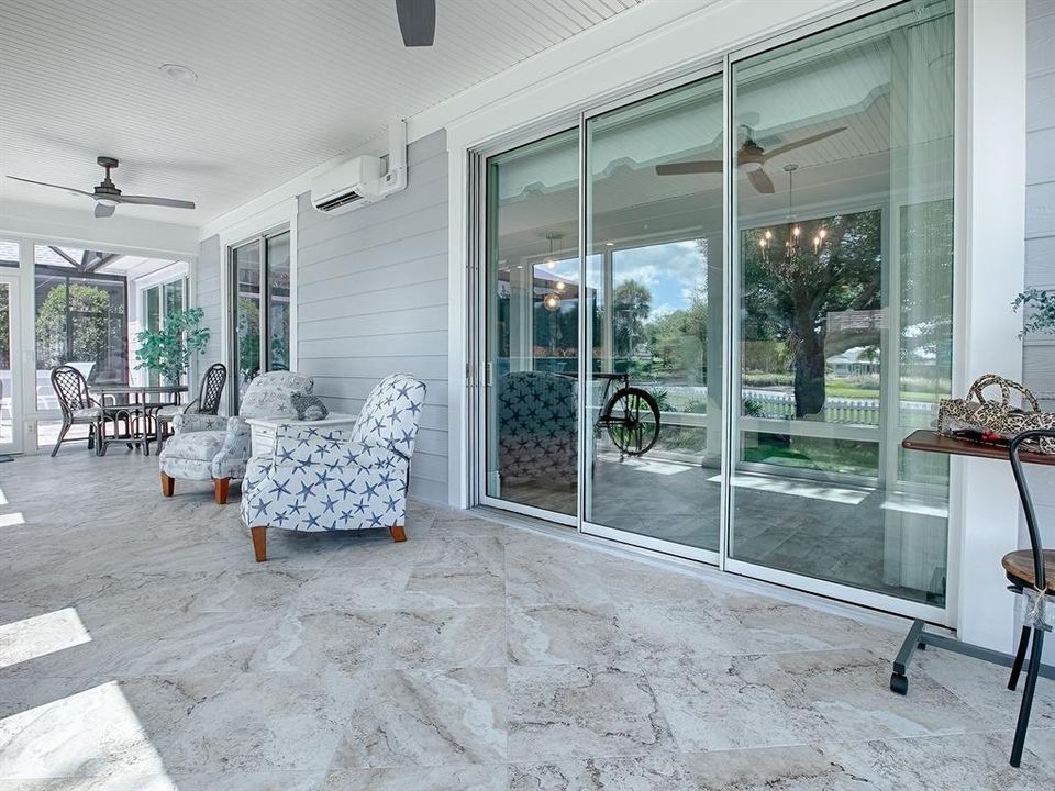 THIS WILL BE YOUR FAVORITE ROOM IN THE HOUSE WITH DIAGONAL TILE FLOORING, BEADBOARD CEILING, CUSTOM FANS, AND UNDER HEAT AND AIR WITH THE MINI-SPLIT.