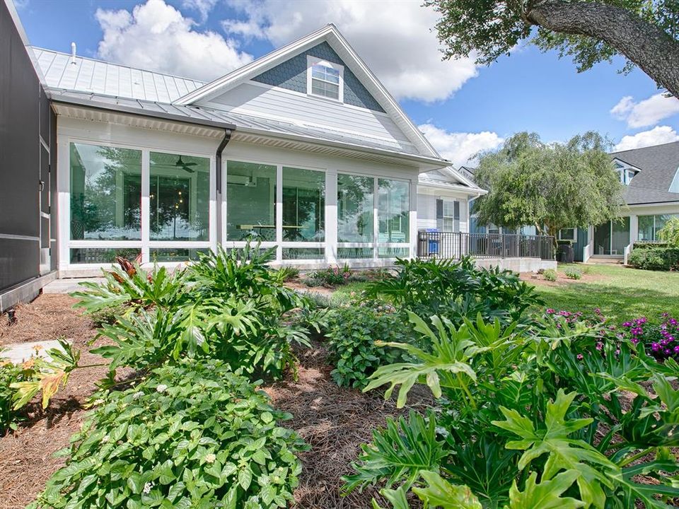 BEAUTIFUL BEDS AND SPACIOUS BACKYARD.  NEW PATIO WAS ADDED OFF THE FLORIDA ROOM - GREAT FOR GRILLING AND ENJOYING SOME OUTDOOR TIME.