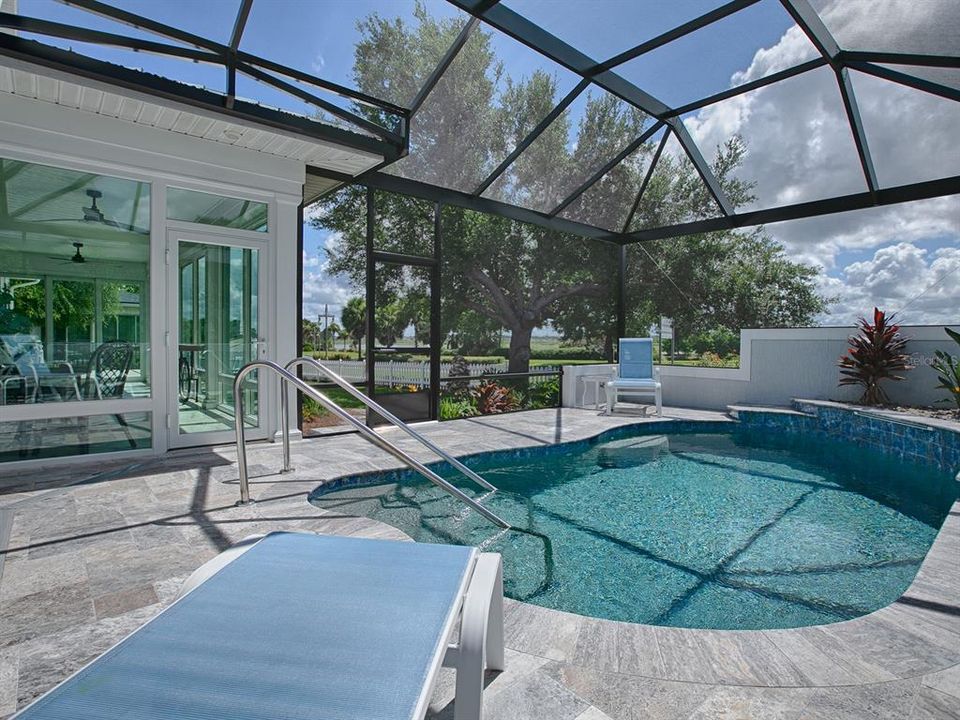 GLASS FLORIDA ROOM RECENTLY ADDED - UNDER HEAT AND AIR WITH MINI-SPLIT, HURRICANE WINDOWS AND NICE OPEN VIEW.