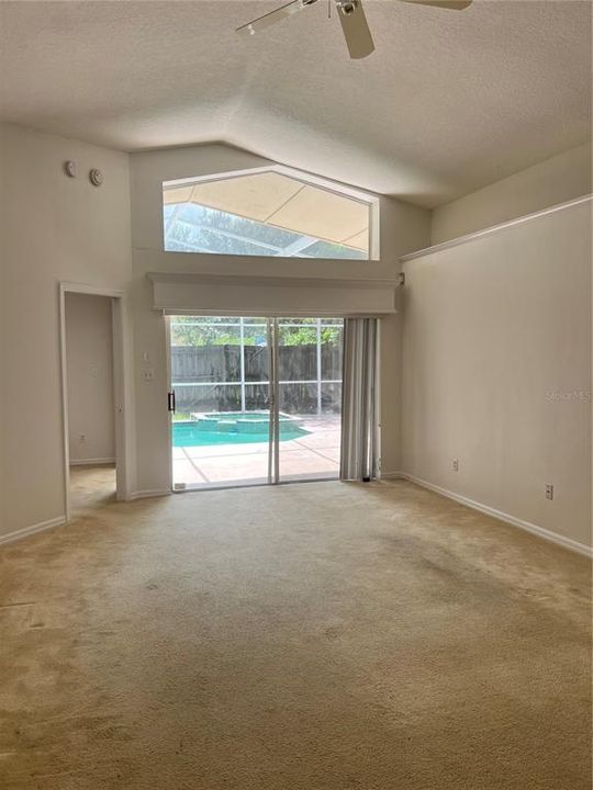 Large great room with view of the pool