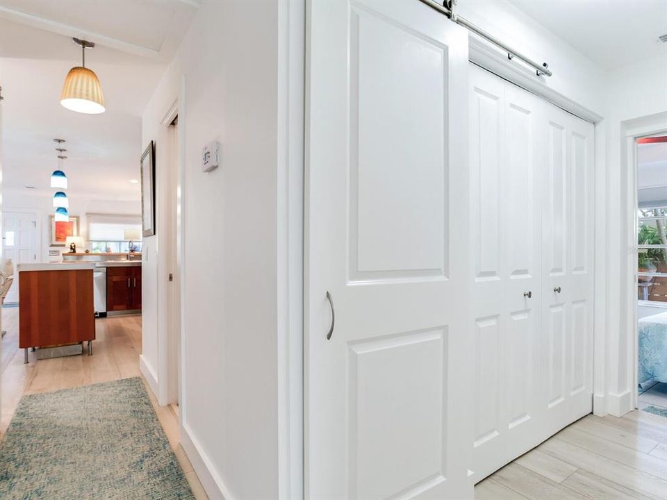 Hall Closets - Linen Closet w/Sliding Barn Door. Clothes Closet w/double bifold doors.