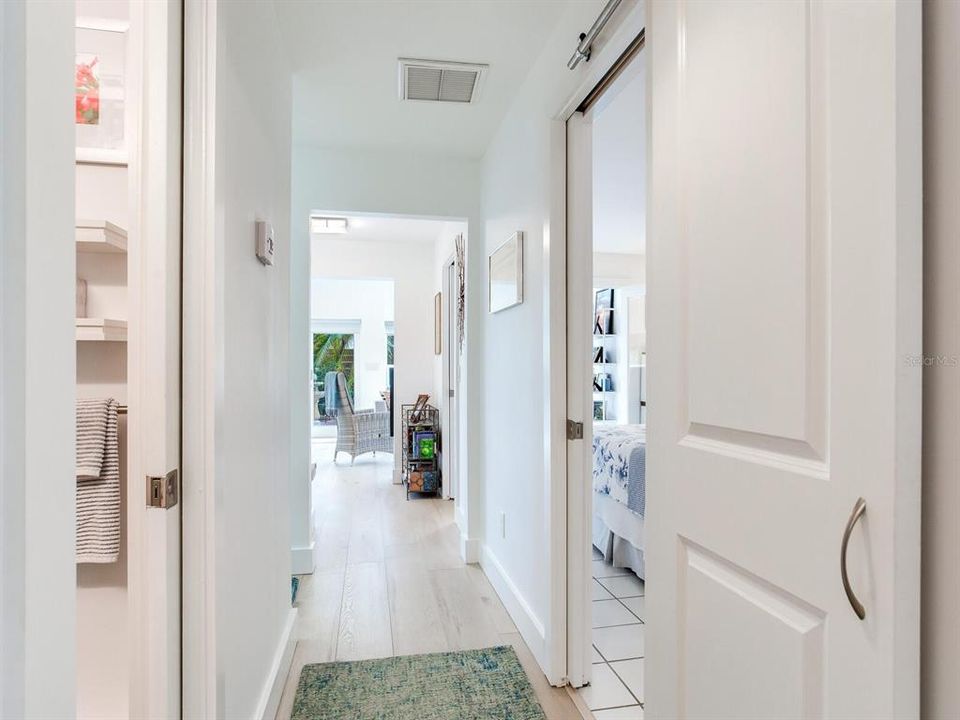 Hall from front living area to bedrooms, baths and sunroom.