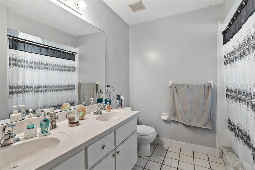 Primary Bathroom with Dual Sinks and Walk-in Shower